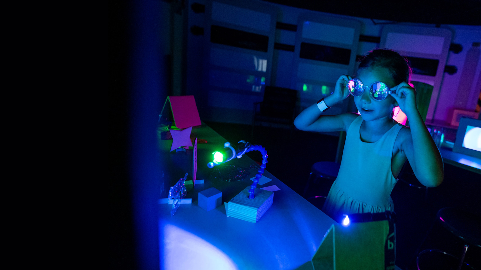Young girl in dark with goggles