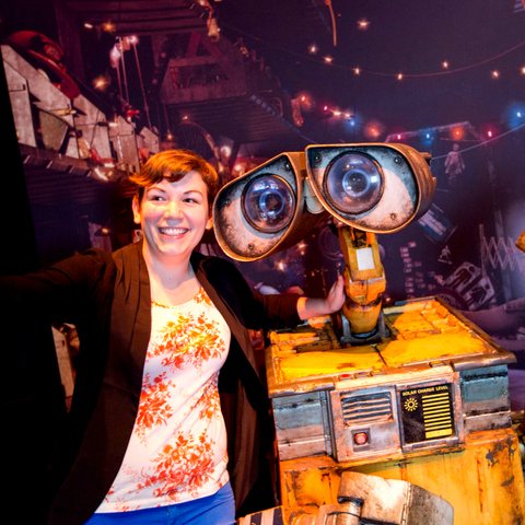 Woman standing with WallE taking a selfie
