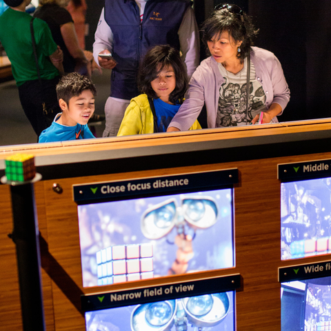 Mom and kids interacting with "focus" via WallE display