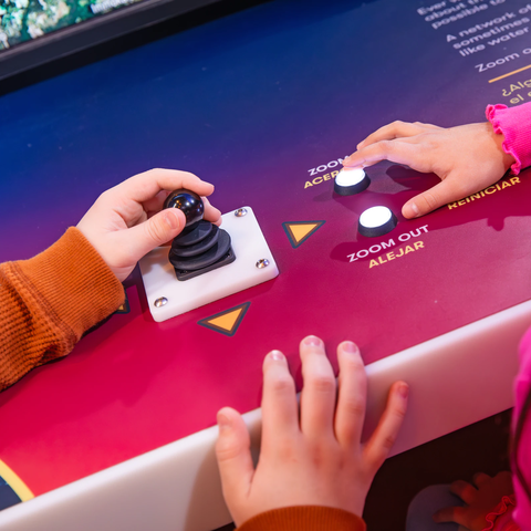 Kids hands playing with space buttons