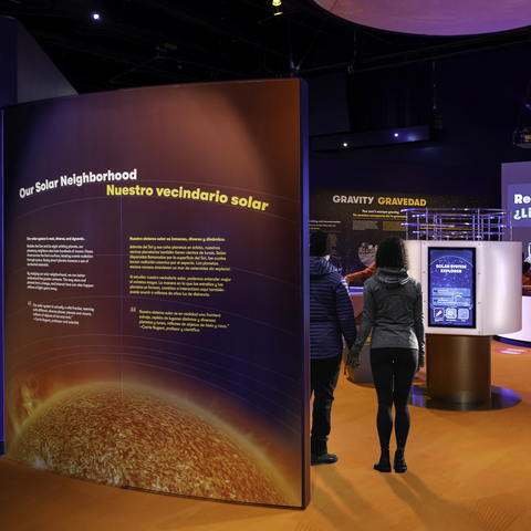 People walking through Exploring Space