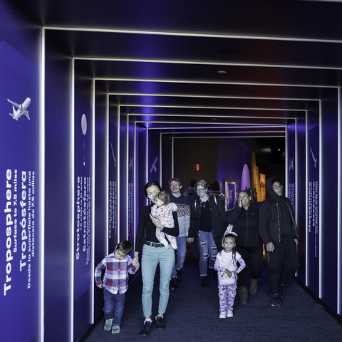 People walking into the Exploring Space exhibit
