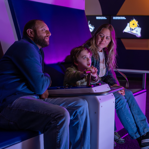 A family in the Space Pods in Exploring Space