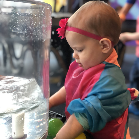 Toddler girl admiring water cyclone
