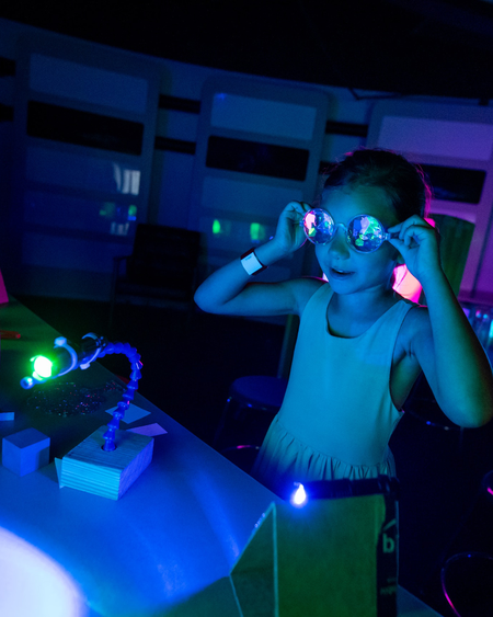 Young girl in dark with goggles