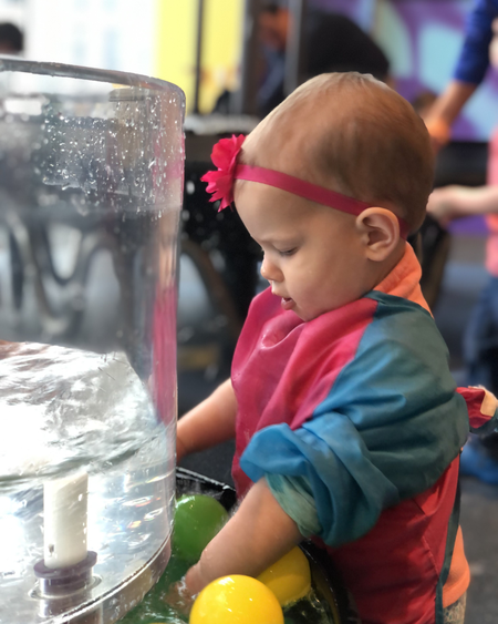 Toddler girl admiring water cyclone
