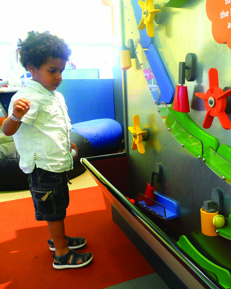 Toddler Playing with Wall