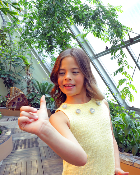 Girl in Butterfly Garden