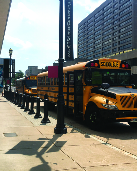 Field trip busses parked in front of the Connecticut Science Center