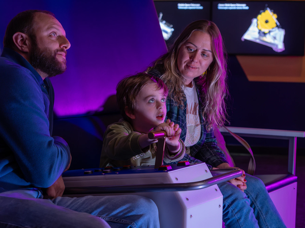 A family in the Space Pods in Exploring Space