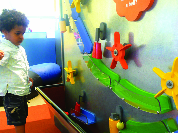Toddler Playing with Wall