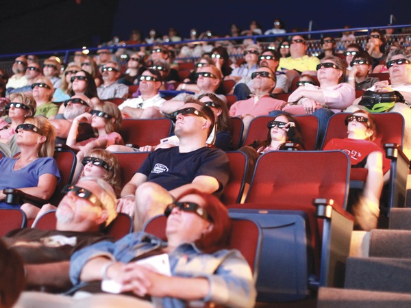 People enjoying movie