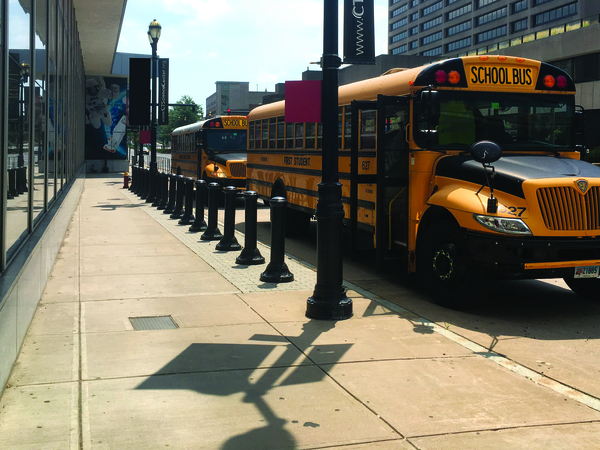 Field trip busses parked in front of the Connecticut Science Center