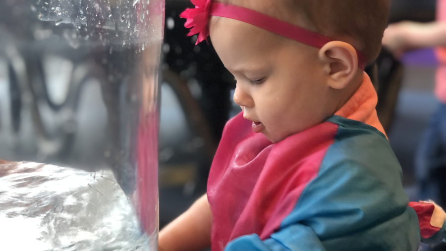 Toddler girl admiring water cyclone