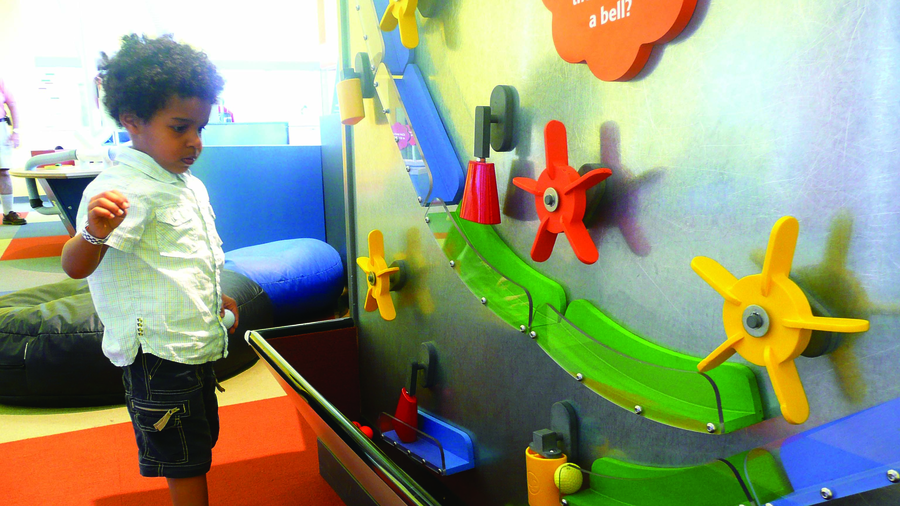 Toddler Playing with Wall